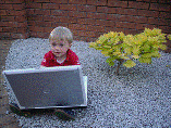 Banner image of young child with laptop